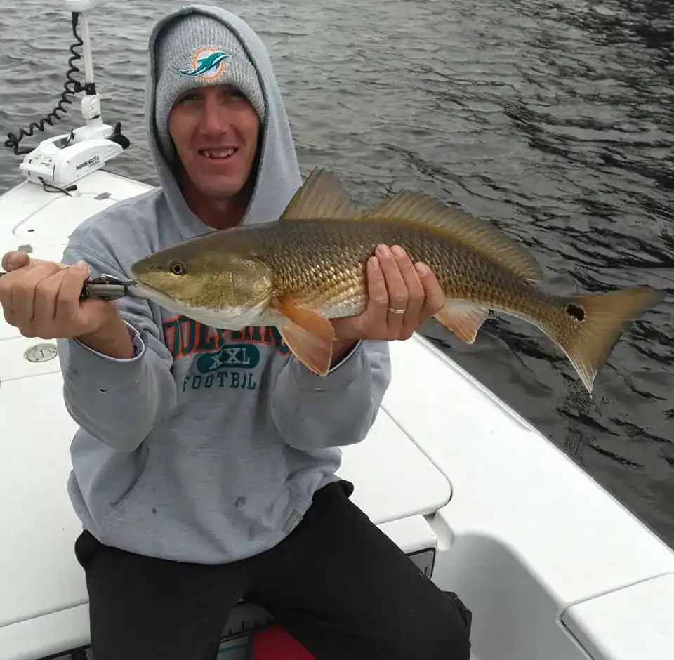 Captain Chris Holleman with a Redfish