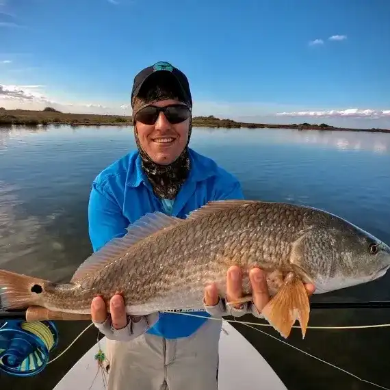 Captain Rick Mendoza with a Redfish