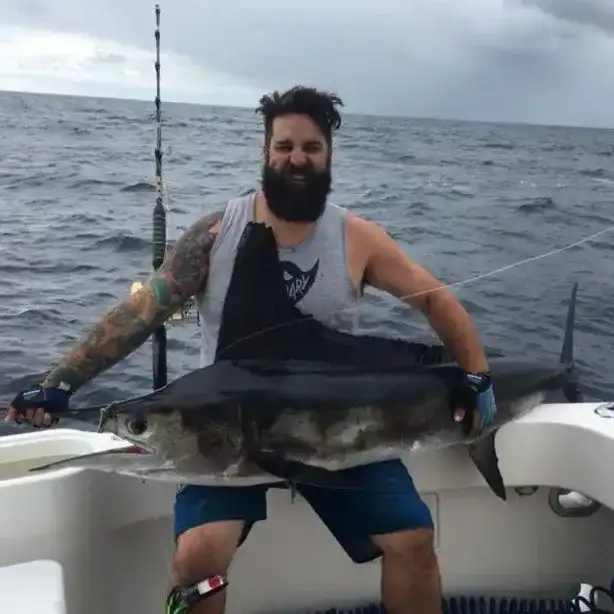 Captain Kerim Hussainy with a Swordfish